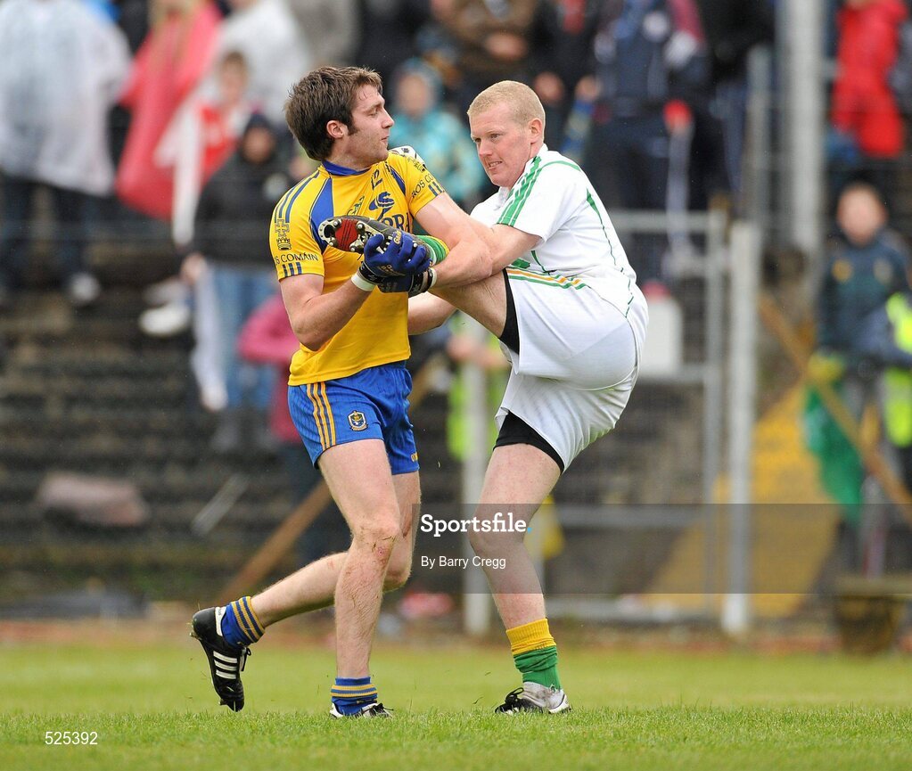 12 June 2011; Cathal Cregg, Roscommon, defends himself from an off the ball challenge from Leitrim goalkeeper Cathal McCrann. Connacht GAA Football Senior Championship Semi-Final, Leitrim v Roscommon, Páirc Seán Mac Diarmada, Carrick-on-Shannon, Co. Leitrim. Picture credit: Barry Cregg / SPORTSFILE