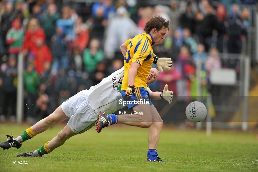 12 June 2011; Conor Devaney, Roscommon, goes past the tackle of Leitrim goalkeeper Cathal McCrann to score his side's second goal. Connacht GAA Football Senior Championship Semi-Final, Leitrim v Roscommon, Páirc Seán Mac Diarmada, Carrick-on-Shannon, Co. Leitrim. Picture credit: Barry Cregg / SPORTSFILE