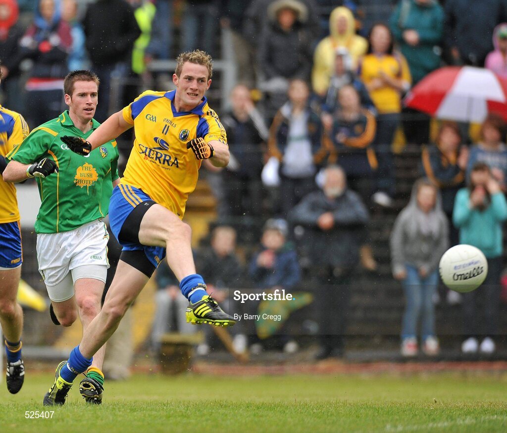 12 June 2011; Kevin Higgins, Roscommon, gets a shot on goal after getting past Barry Prior, Leitrim. Connacht GAA Football Senior Championship Semi-Final, Leitrim v Roscommon, Páirc Seán Mac Diarmada, Carrick-on-Shannon, Co. Leitrim. Picture credit: Barry Cregg / SPORTSFILE
