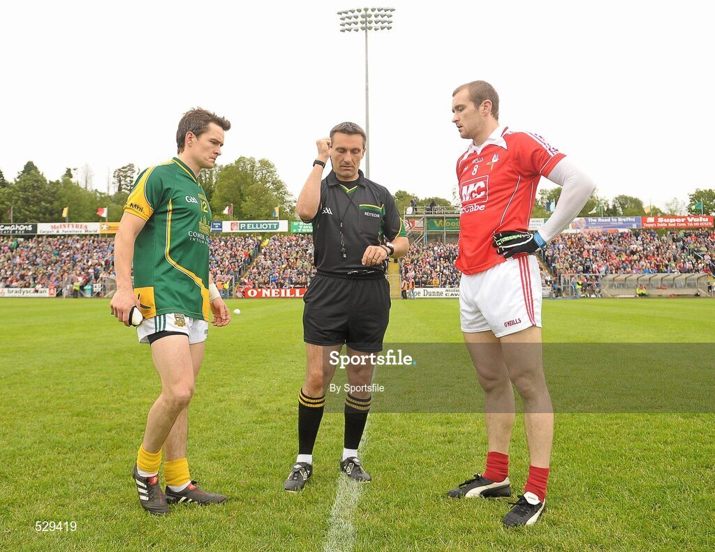 25 June 2011; Meath captain Seamus Kenny and Louth captain Paddy keenan look on as referee Maurice Deegan tosses the coin before the game. GAA Football All-Ireland Senior Championship Qualifier Round 1, Louth v Meath, Kingspan Breffni Park, Co. Cavan. Photo by Sportsfile