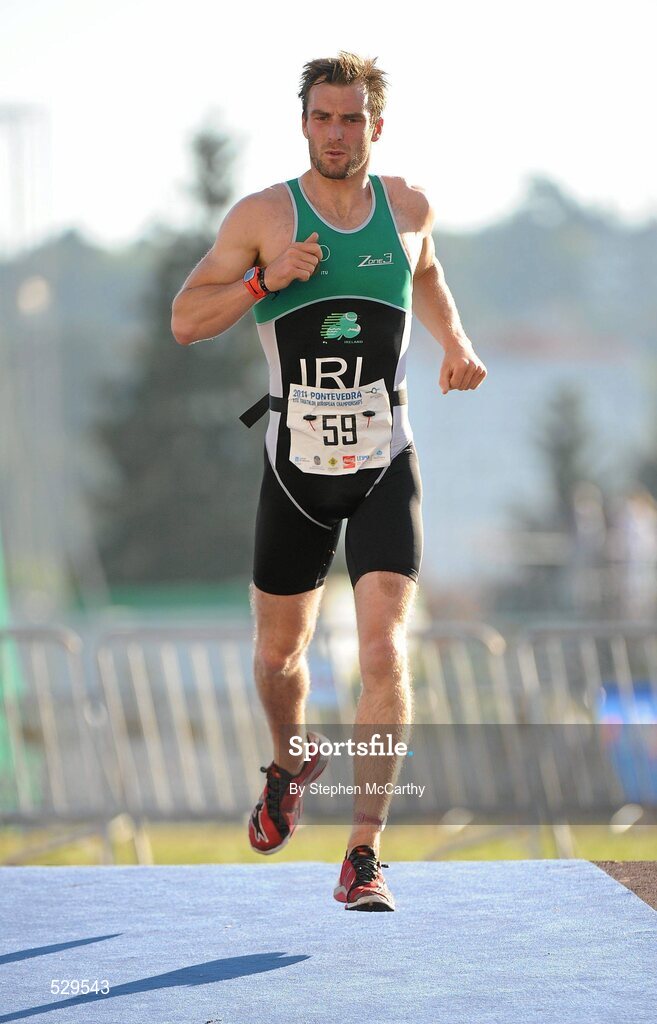 25 June 2011; Ireland's Carl Russell, from Portrush, Co. Antrim, on his way to 7th position in the 30-34 Male Age Group Sprint event, in a time of 01:07:48, at the 2011 Pontevedra ETU Triathlon European Championships. Pontevedra, Spain. Picture credit: Stephen McCarthy / SPORTSFILE