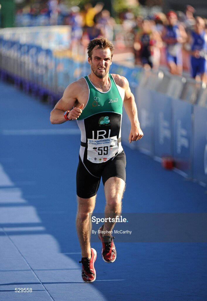 25 June 2011; Ireland's Carl Russell, from Portrush, Co. Antrim, on his way to 7th position in the 30-34 Male Age Group Sprint event, in a time of 01:07:48, at the 2011 Pontevedra ETU Triathlon European Championships. Pontevedra, Spain. Picture credit: Stephen McCarthy / SPORTSFILE