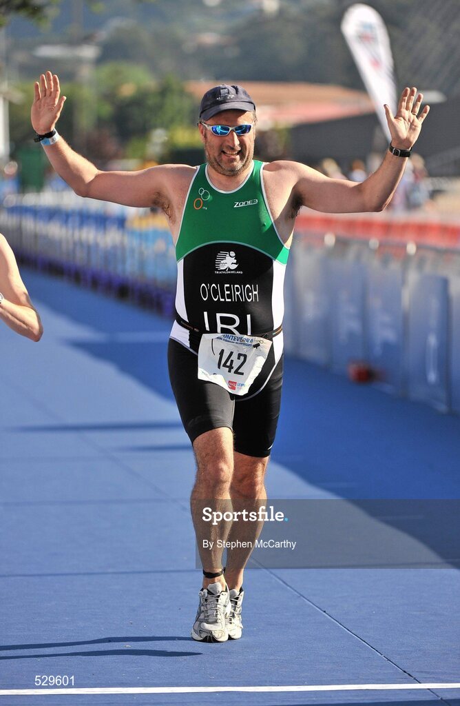 25 June 2011; Ireland's Niall O'Cleirigh, from Rathgar, Dublin, celebrates on the approach to the finish and taking 28th place in the 45-49 Male Age Group Sprint event, with a time of 01:30:12, at the 2011 Pontevedra ETU Triathlon European Championships. Pontevedra, Spain. Picture credit: Stephen McCarthy / SPORTSFILE