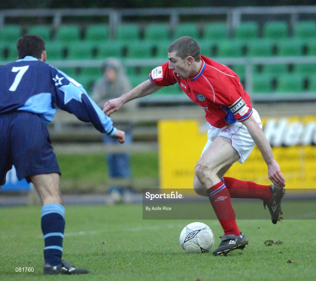 23 December 2001; Owen Heary of Shelbourne is tackled by John Martin of UCD during the eircom League Premier Division match between UCD and Shelbourne at Belfield Park in Dublin. Photo by Aofie Rice/Sportsfile
