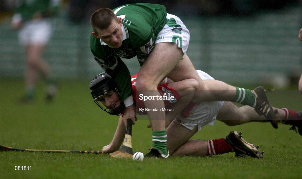25 February 2002; Mark Foley of Limerick in action against Kieran Murphy of Cork during the Allianz National Hurling League Division 1B Round 1 match between Limerick and Cork at the Gaelic Grounds in Limerick. Photo by Brendan Moran/Sportsfile
