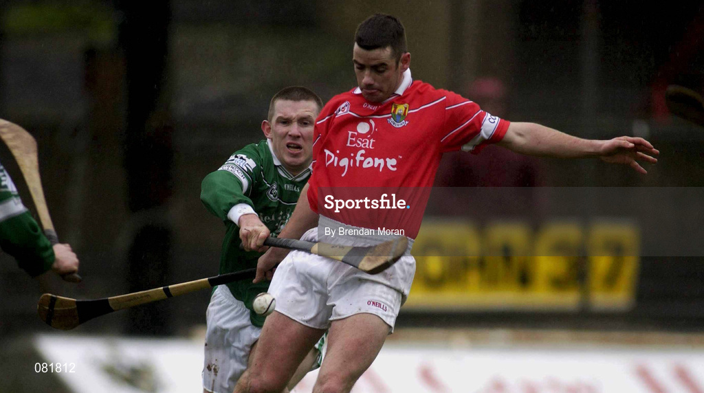 25 February 2002; Mark Prendergast of Cork in action against Mark Foley of Limerick during the Allianz National Hurling League Division 1B Round 1 match between Limerick and Cork at the Gaelic Grounds in Limerick. Photo by Brendan Moran/Sportsfile