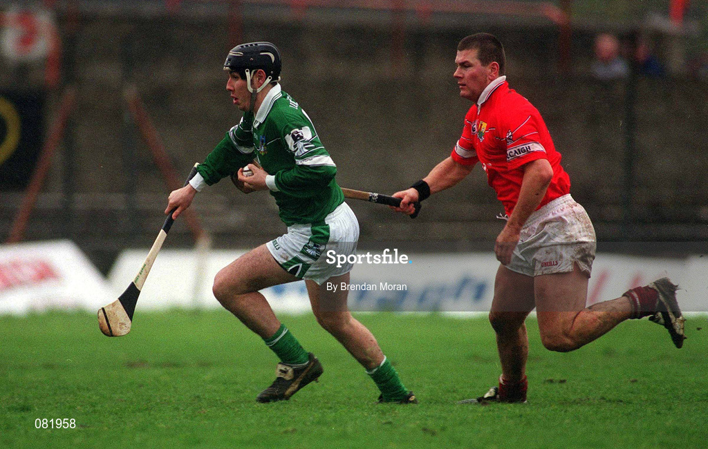25 February 2002; Mark Keane of Limerick, in action against Diarmuid O'Sullivan of Cork during the Allianz National Hurling League Division 1B Round 1 match between Limerick and Cork at the Gaelic Grounds in Limerick. Photo by Brendan Moran/Sportsfile