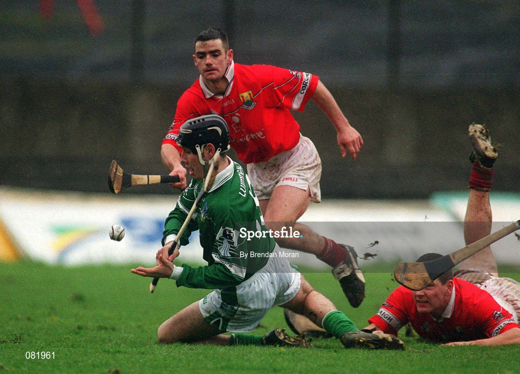 25 February 2002; Mark Keane of Limerick in action against Diarmuid O'Sullivan, right, and Mark Prendergast, both of Cork, during the Allianz National Hurling League Division 1B Round 1 match between Limerick and Cork at the Gaelic Grounds in Limerick. Photo by Brendan Moran/Sportsfile