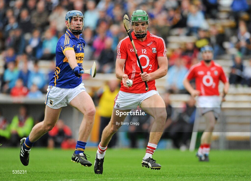 15 July 2011; Aidan Walsh, Cork, in action against Paddy Murphy, Tipperary. Bord Gáis Energy Munster GAA Hurling Under 21 Championship Semi-Final, Tipperary v Cork, Semple Stadium, Thurles, Co. Tipperary. Picture credit: Barry Cregg / SPORTSFILE