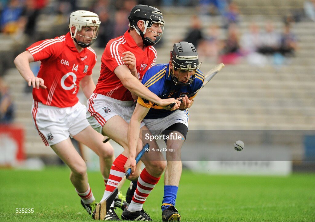 15 July 2011; Ciarán Hough, Tipperary, in action against Jamie Coughlan, centre, and Michael O'Sullivan, Cork. Bord Gáis Energy Munster GAA Hurling Under 21 Championship Semi-Final, Tipperary v Cork, Semple Stadium, Thurles, Co. Tipperary. Picture credit: Barry Cregg / SPORTSFILE
