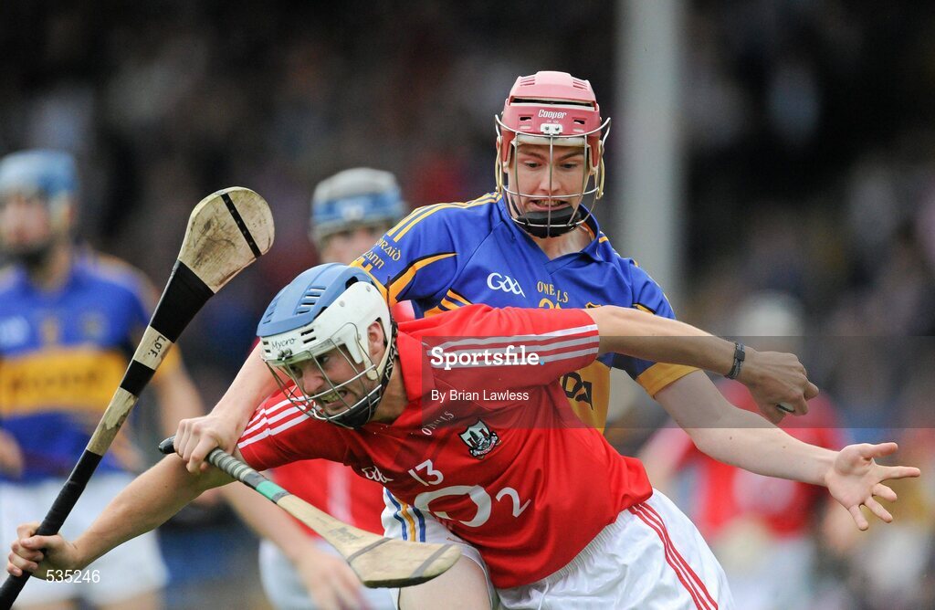 15 July 2011; Luke O'Farrell, Cork, in action against Stephen Maher, Tipperary. Bord Gáis Energy Munster GAA Hurling Under 21 Championship Semi-Final, Tipperary v Cork, Semple Stadium, Thurles, Co. Tipperary. Picture credit: Brian Lawless / SPORTSFILE