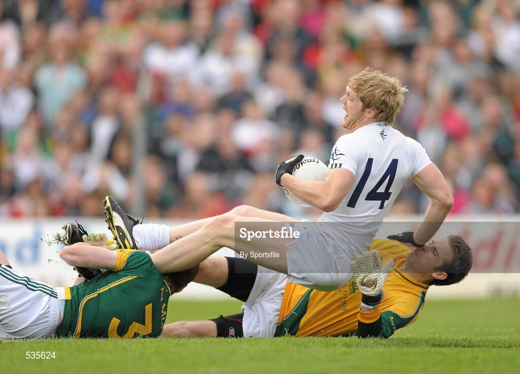 16 July 2011; Tomas O'Connor, Kildare, is brought down in the box by Meath players Kevin Reilly and goalkeeper Brendan Murphy, right, to earn his side a penalty. GAA Football All-Ireland Senior Championship Qualifier, Round 3, Meath v Kildare, Pairc Tailteann, Navan, Co. Meath. Photo by Sportsfile