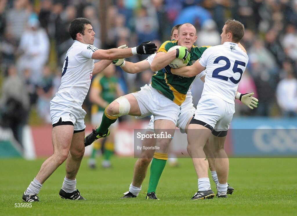 16 July 2011; Joe Sheridan, Meath, in action against Padraig O'Neill, left, Daryl Flynn, and Brian Flanagan, right, Kildare. GAA Football All-Ireland Senior Championship Qualifier, Round 3, Meath v Kildare, Pairc Tailteann, Navan, Co. Meath. Photo by Sportsfile