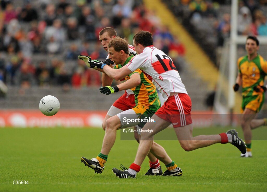 17 July 2011; Anthony Thompson, Donegal, in action against Michael Bateson and Barry McGoldrick, Derry. Ulster GAA Football Senior Championship Final, Derry v Donegal, St Tiernach's Park, Clones, Co. Monaghan. Picture credit: Oliver McVeigh / SPORTSFILE