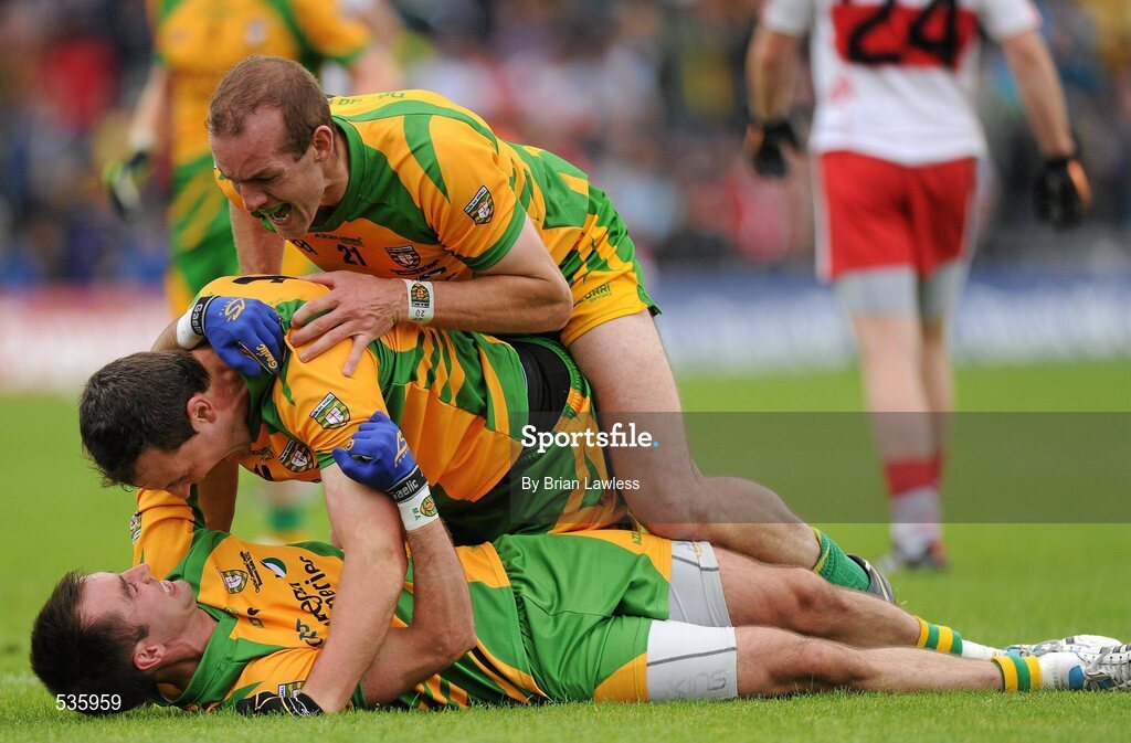17 July 2011; Donegal captain Michael Murphy, centre, celebrates with team-mates Karl Lacey and Neil Gallagher, top, at the final whistle. Ulster GAA Football Senior Championship Final, Derry v Donegal, St Tiernach's Park, Clones, Co. Monaghan. Picture credit: Brian Lawless / SPORTSFILE