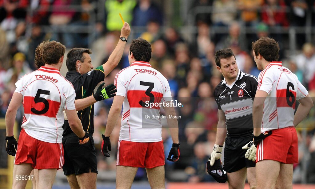 17 July 2011; Derry goalkeeper Danny Devlin is shown a yellow card by referee Maurice Deegan. Ulster GAA Football Senior Championship Final, Derry v Donegal, St Tiernach's Park, Clones, Co. Monaghan. Picture credit: Brendan Moran / SPORTSFILE