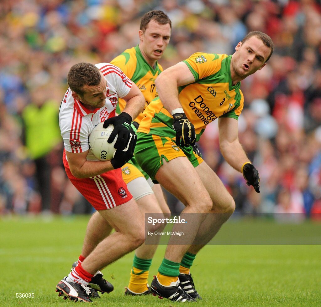 17 July 2011; Emmett McGuckin, Derry, collides with Neil McGee, Donegal, in the penalty area. Ulster GAA Football Senior Championship Final, Derry v Donegal, St Tiernach's Park, Clones, Co. Monaghan. Picture credit: Oliver McVeigh / SPORTSFILE