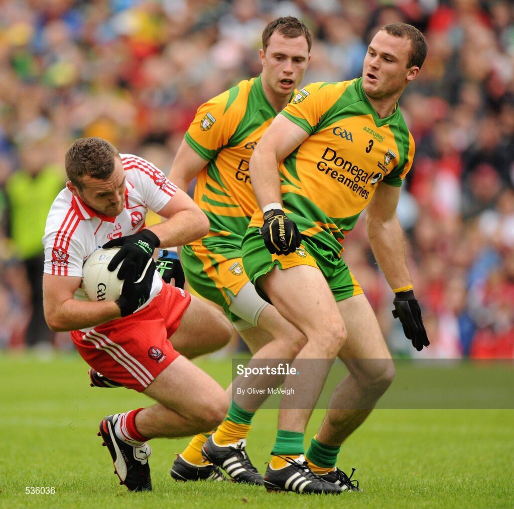 17 July 2011; Emmett McGuckin, Derry, collides with Neil McGee, Donegal, in the penalty area. Ulster GAA Football Senior Championship Final, Derry v Donegal, St Tiernach's Park, Clones, Co. Monaghan. Picture credit: Oliver McVeigh / SPORTSFILE