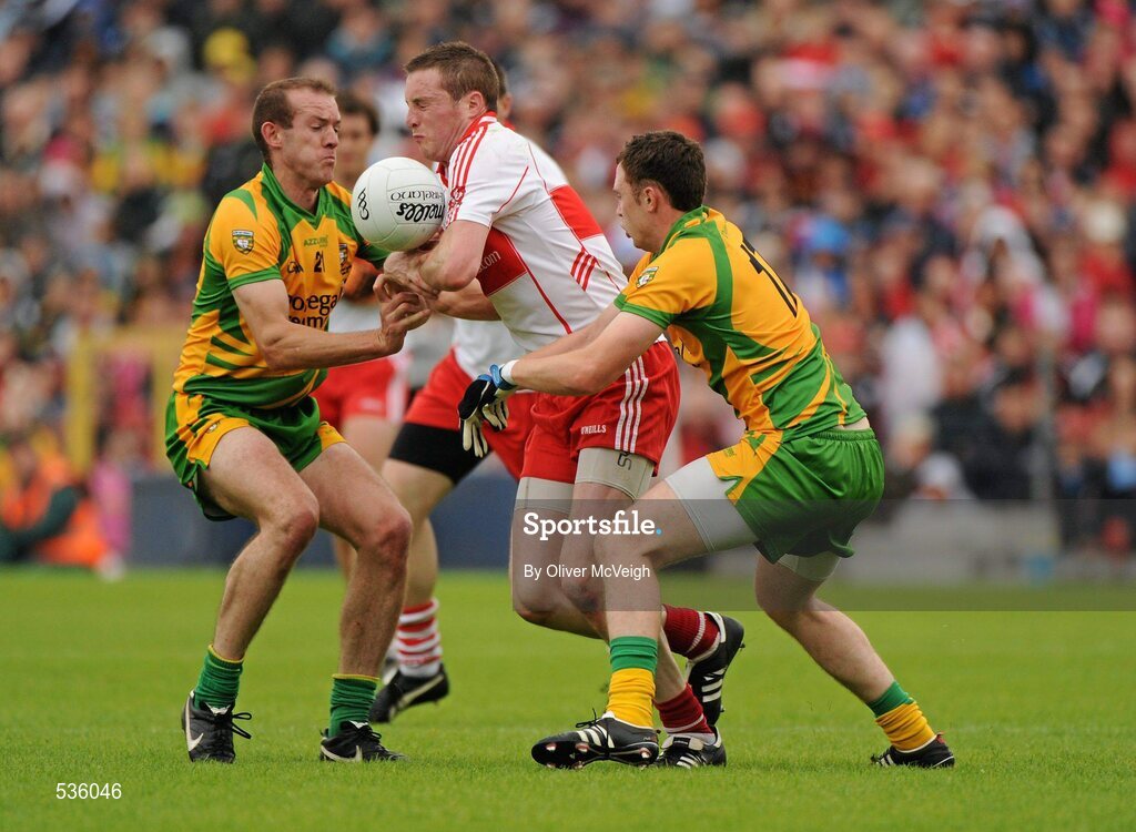 17 July 2011; Joe Diver, Derry, in action against Neil Gallagher and Martin McElhinney, Donegal. Ulster GAA Football Senior Championship Final, Derry v Donegal, St Tiernach's Park, Clones, Co. Monaghan. Picture credit: Oliver McVeigh / SPORTSFILE