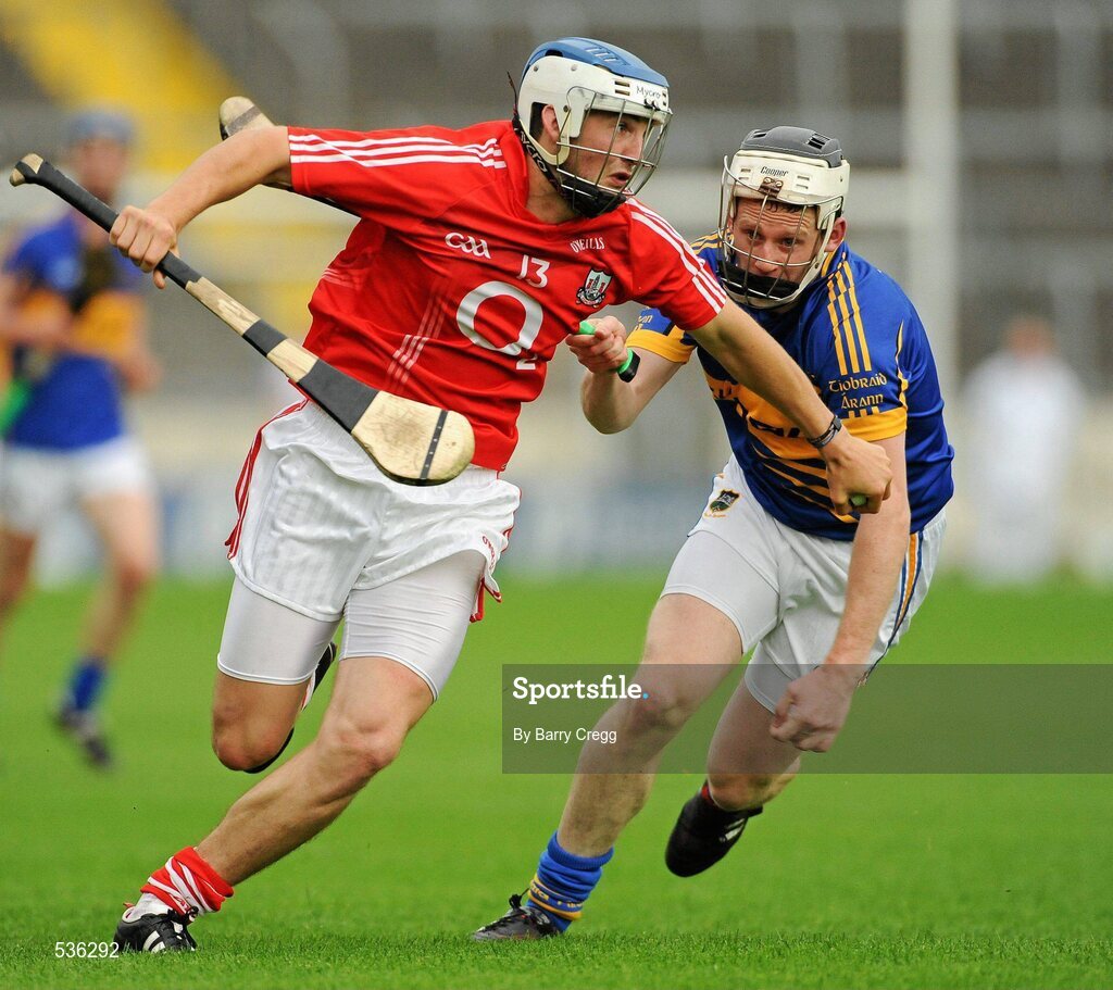 15 July 2011; Luke O'Farrell, Cork in action against Sean O'Brien, Tipperary. Bord Gáis Energy Munster GAA Hurling Under 21 Championship Semi-Final, Tipperary v Cork, Semple Stadium, Thurles, Co. Tipperary. Picture credit: Barry Cregg / SPORTSFILE