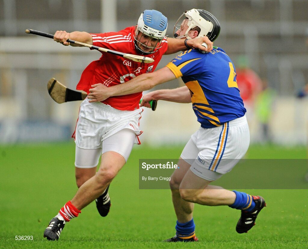 15 July 2011; Luke O'Farrell, Cork in action against Sean O'Brien, Tipperary. Bord Gáis Energy Munster GAA Hurling Under 21 Championship Semi-Final, Tipperary v Cork, Semple Stadium, Thurles, Co. Tipperary. Picture credit: Barry Cregg / SPORTSFILE