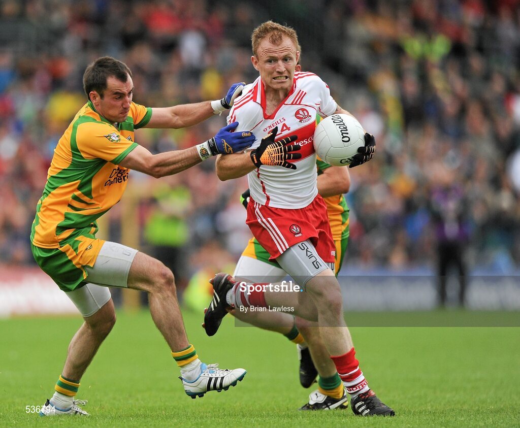 17 July 2011; Martin Donaghy, Derry, in action against Karl Lacey, Donegal. Ulster GAA Football Senior Championship Final, Derry v Donegal, St Tiernach's Park, Clones, Co. Monaghan. Picture credit: Brian Lawless / SPORTSFILE