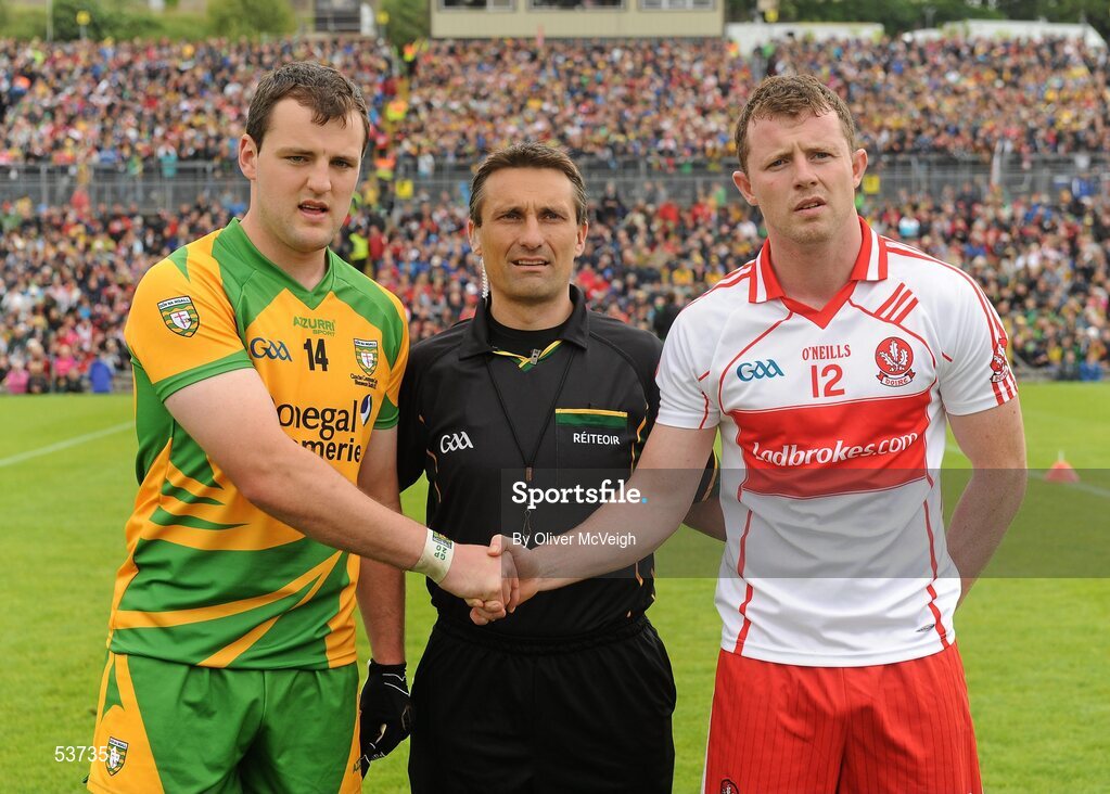 17 July 2011; Donegal Captain Michael Murphy, shakes hands with Derry Captain Bary McGoldrick, watched by  Referee Maurice Deegan. Ulster GAA Football Senior Championship Final, Derry v Donegal, St Tiernach's Park, Clones, Co. Monaghan. Picture credit: Oliver McVeigh / SPORTSFILE