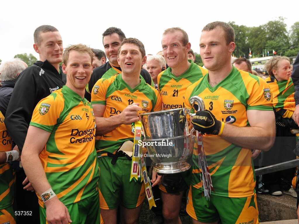 17 July 2011; Anthony Thompson, Ryan Bradley, Neil Gallagher and Neil McGee, Donegal, with the cup after the game. Ulster GAA Football Senior Championship Final, Derry v Donegal, St Tiernach's Park, Clones, Co. Monaghan. Picture credit: Oliver McVeigh / SPORTSFILE