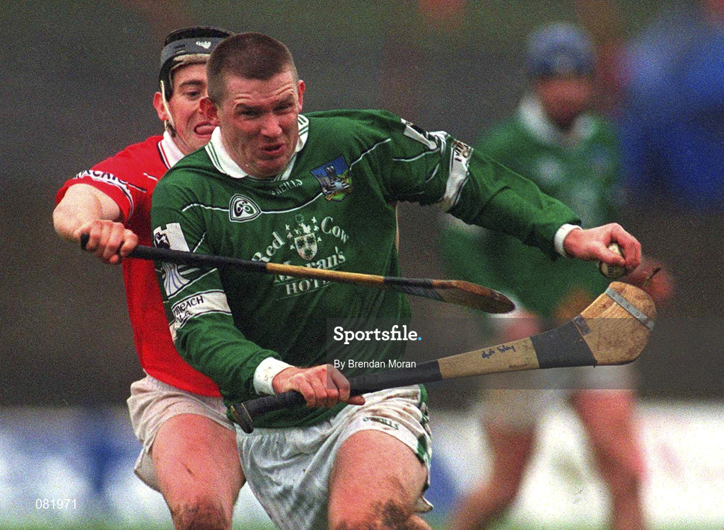 25 February 2002; Mark Foley of Limerick in action against Cork's Pat Ryan during the Allianz National Hurling League Division 1B Round 1 match between Limerick and Cork at the Gaelic Grounds in Limerick. Photo by Brendan Moran/Sportsfile