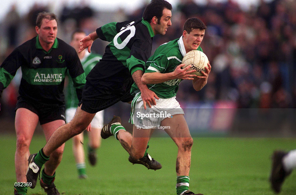 2 March 2002; Aidan Higgins of Charlestown Sarsfield is tackled by John Coogan of Nemo Rangers during the AIB GAA Football All-Ireland Senior Club Championship Semi-Final match between Nemo Rangers and Charlestown Sarsfield at McDonagh Park in Nenagh, Tipperary. Photo by Damien Eagers/Sportsfile
