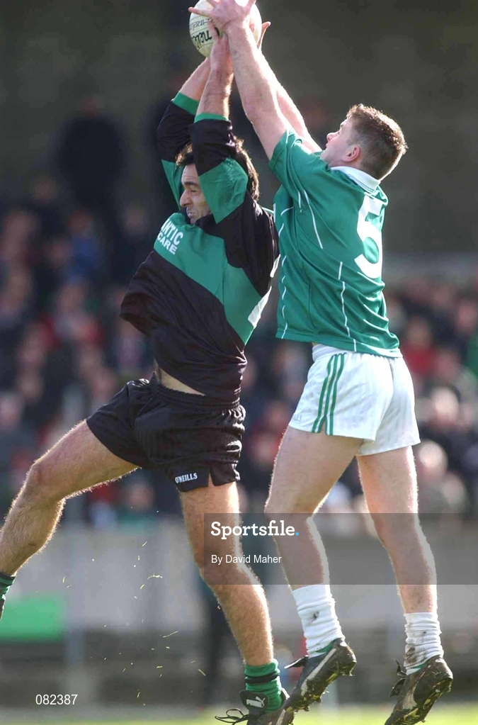 2 March 2002; John Coogan of Nemo Rangers in action against Dermot Higgins of Charlestown Sarsfields during the AIB GAA Football All-Ireland Senior Club Championship Semi-Final match between Nemo Rangers and Charlestown Sarsfield at McDonagh Park in Nenagh, Tipperary. Photo by David Maher/Sportsfile