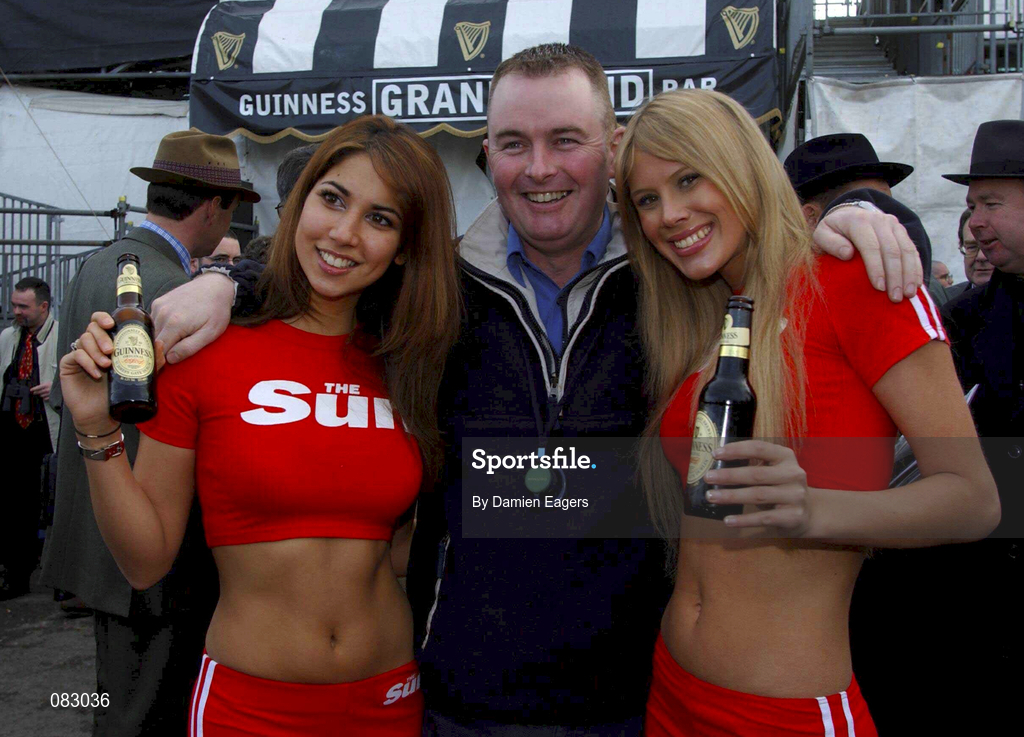 12 March 2002; Mick O'Sullivan, from Cork pictured with models Leilana, left and Joanne prior to racing on day one of the Cheltenham Racing Festival at Prestbury Park in Cheltenham, England. Photo by Damien Eagers/Sportsfile