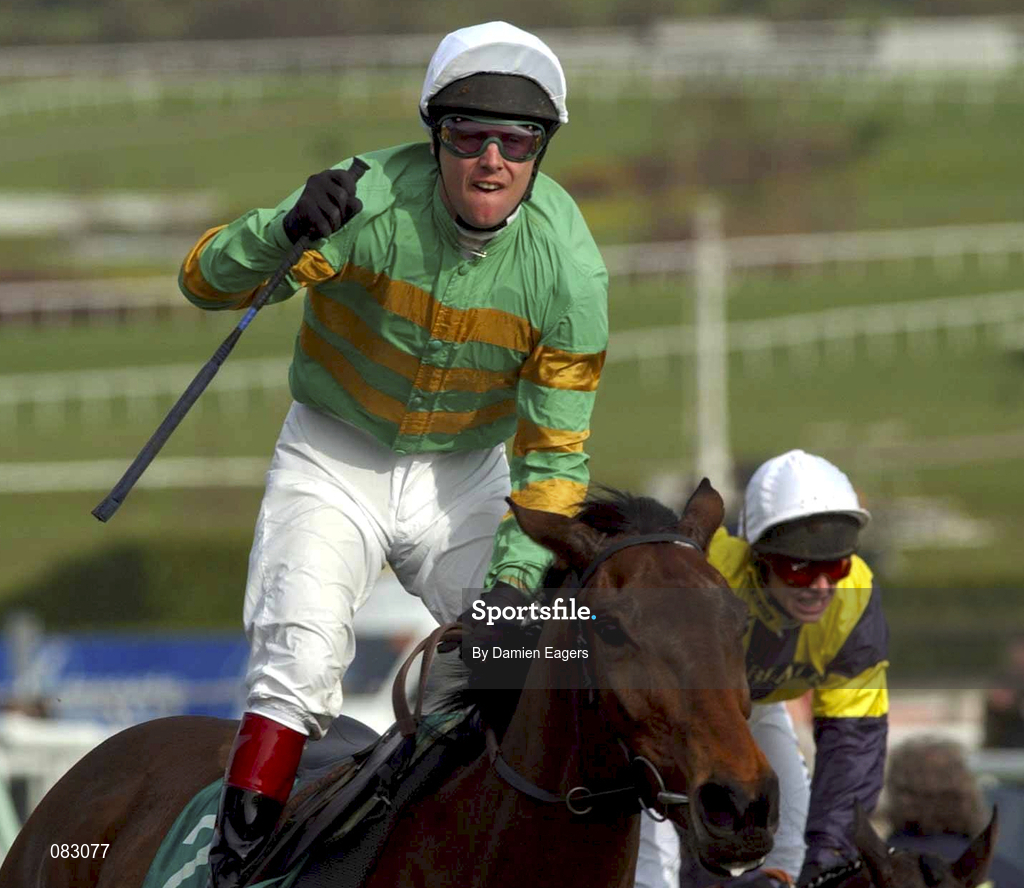 12 March 2002; Jockey Charlie Swan celebrates as he crosses the line to win the Gerrard Supreme Novices Hurdle on Like a Butterfly, from second place Westender, with Tony McCoy up, during day one of the Cheltenham Racing Festival at Prestbury Park in Cheltenham, England. Photo by Damien Eagers/Sportsfile