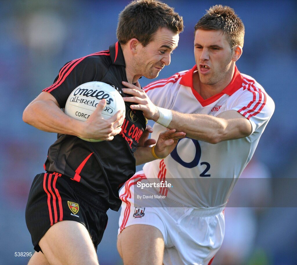 23 July 2011; Mark Poland, Down, in action against Eoin Cadogan, Cork. GAA Football All-Ireland Senior Championship Qualifier Round 4, Cork v Down, Croke Park, Dublin. Picture credit: David Maher / SPORTSFILE