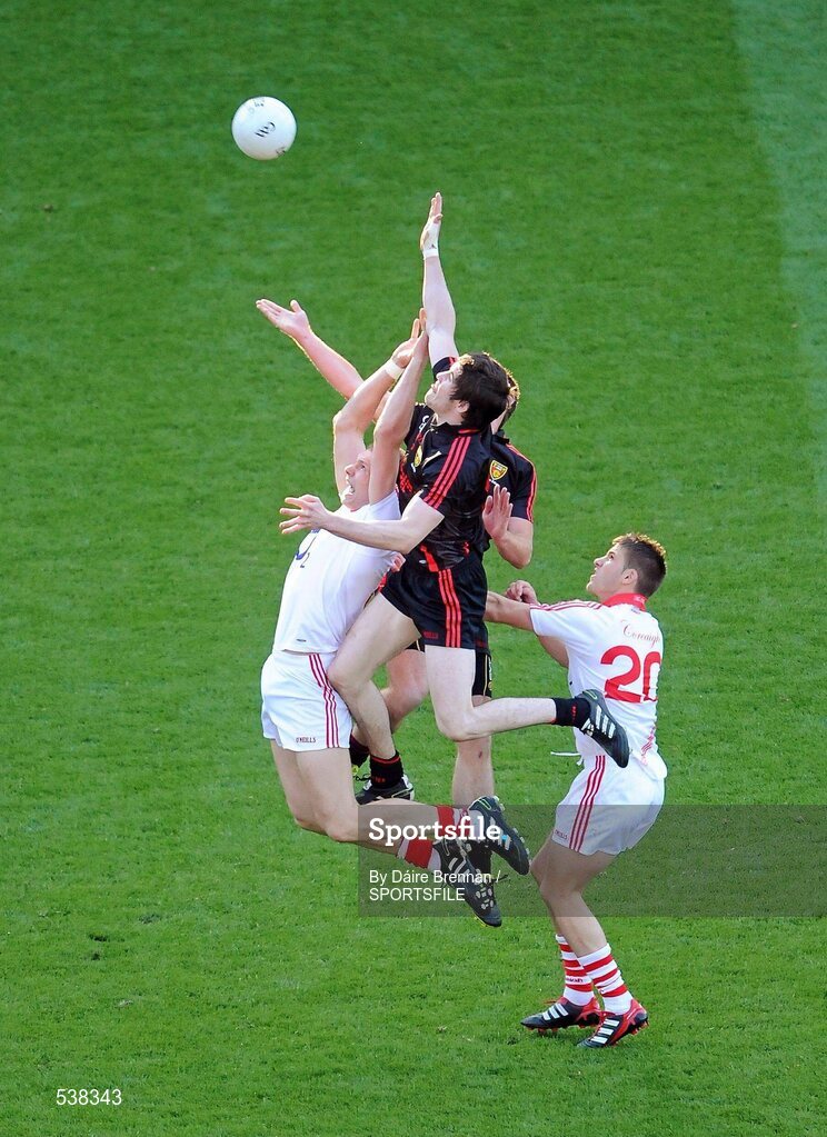 23 July 2011; Alan O'Connor, Cork, contests a high ball against Anton McArdle and Peter Fitzpatrick, hidden, Down. GAA Football All-Ireland Senior Championship Qualifier Round 4, Cork v Down, Croke Park, Dublin. Picture credit: Dáire Brennan / SPORTSFILE