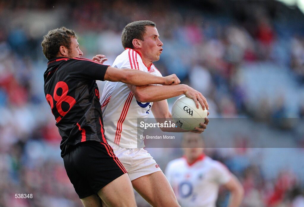 23 July 2011; Patrick Kelly, Cork, gains possession ahead of Darren O'Hagan, Down. GAA Football All-Ireland Senior Championship Qualifier Round 4, Cork v Down, Croke Park, Dublin. Picture credit: Brendan Moran / SPORTSFILE