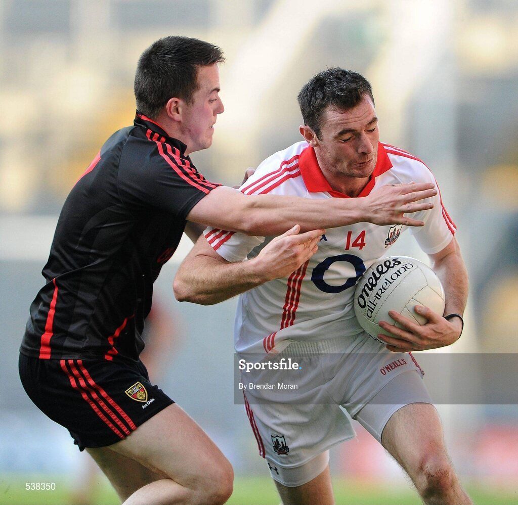 23 July 2011; Donncha O'Connor, Cork, is tackled by Conor Garvey, Down. GAA Football All-Ireland Senior Championship Qualifier Round 4, Cork v Down, Croke Park, Dublin. Picture credit: Brendan Moran / SPORTSFILE