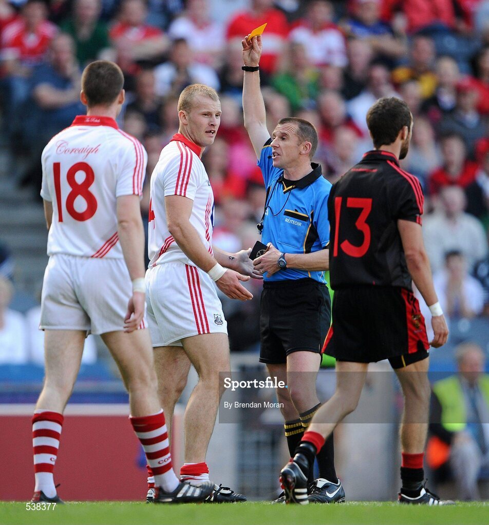 23 July 2011; Michael Shields, Cork, is shown a yellow card by referee Michael Duffy after a tackle on Kevin McKernan, Down. GAA Football All-Ireland Senior Championship Qualifier Round 4, Cork v Down, Croke Park, Dublin. Picture credit: Brendan Moran / SPORTSFILE