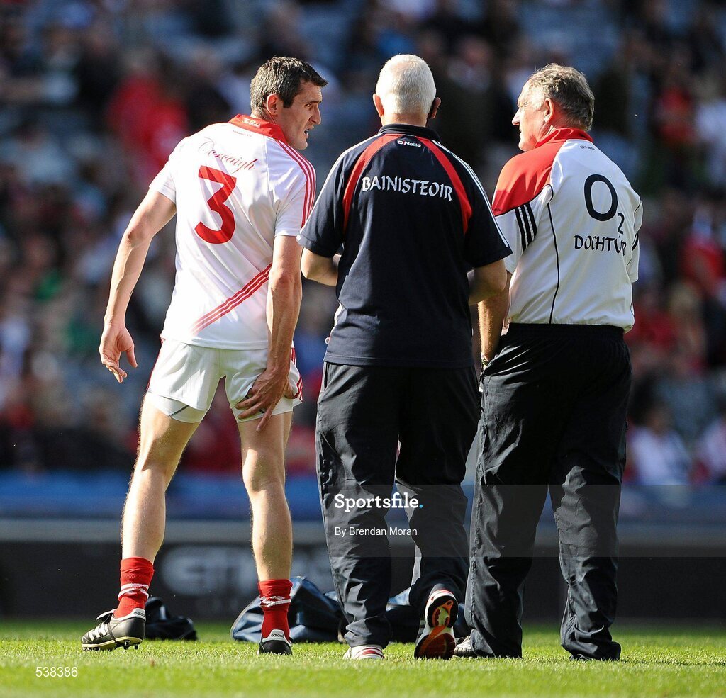 23 July 2011; Cork full-back Graham Canty holds his leg during the warm-up before the game while in conversation with manager Conor Counihan and team doctor, Dr. Con Murphy. Canty subsequently did not start the game. GAA Football All-Ireland Senior Championship Qualifier Round 4, Cork v Down, Croke Park, Dublin. Picture credit: Brendan Moran / SPORTSFILE
