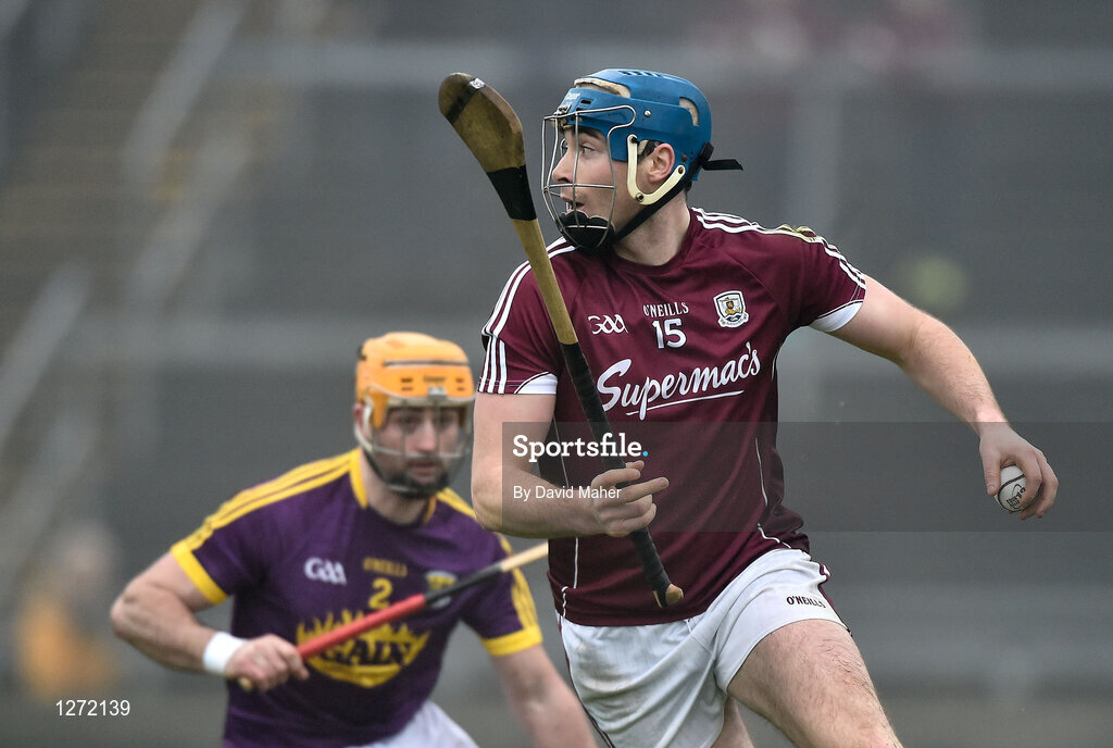 19 February 2017; Conor Cooney of Galway in action against Eóin Moore of Wexford during the Allianz Hurling League Division 1B Round 2 match between Galway and Wexford at Pearse Stadium in Galway. Photo by David Maher/Sportsfile