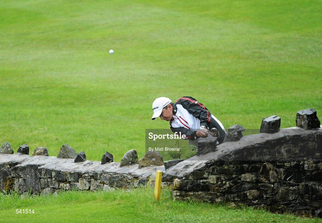 30 July 2011; Peter Lawrie plays from behind a wall on the 13th fairway during the third round of the 2011 Discover Ireland Irish Open Golf Championship, Killarney Golf & Fishing Club, Killarney, Co. Kerry. Picture credit: Matt Browne / SPORTSFILE