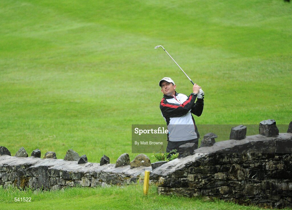 30 July 2011; Peter Lawrie watches his ball after playing  from behind a wall on the 13th fairway during the third round of the 2011 Discover Ireland Irish Open Golf Championship, Killarney Golf & Fishing Club, Killarney, Co. Kerry. Picture credit: Matt Browne / SPORTSFILE