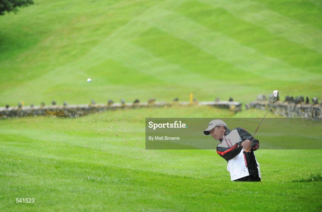30 July 2011; Peter Lawrie plays from a bunker onto the 13th green during the third round of the 2011 Discover Ireland Irish Open Golf Championship, Killarney Golf & Fishing Club, Killarney, Co. Kerry. Picture credit: Matt Browne / SPORTSFILE