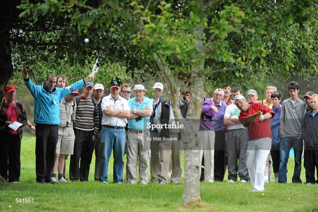 30 July 2011; Damien McGrane plays his second shot from under the trees off the 2nd fairway during the third round of the 2011 Discover Ireland Irish Open Golf Championship, Killarney Golf & Fishing Club, Killarney, Co. Kerry. Picture credit: Matt Browne / SPORTSFILE