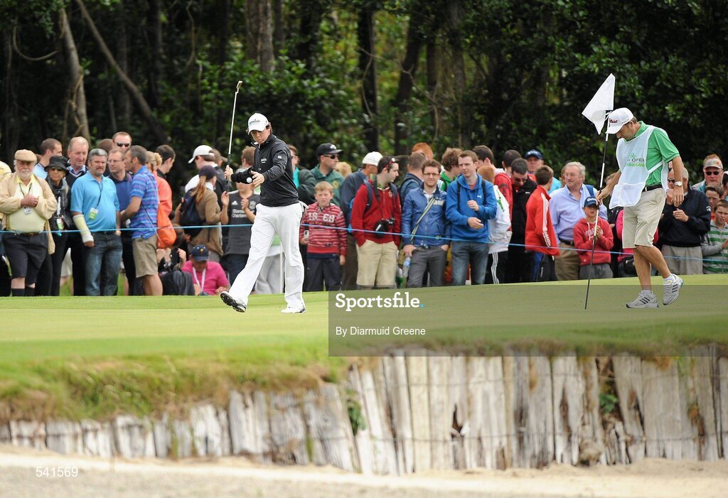 30 July 2011; Rory McIlroy attempts to hit his ball into the lake after putting for double bogey on the 1st during the third round of the 2011 Discover Ireland Irish Open Golf Championship, Killarney Golf & Fishing Club, Killarney, Co. Kerry. Picture credit: Diarmuid Greene / SPORTSFILE