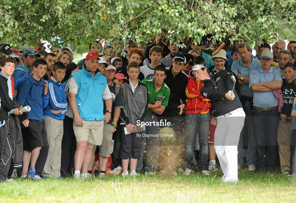 30 July 2011; Rory McIlroy plays from the rough under a tree on the 9th hole during the third round of the 2011 Discover Ireland Irish Open Golf Championship, Killarney Golf & Fishing Club, Killarney, Co. Kerry. Picture credit: Diarmuid Greene / SPORTSFILE