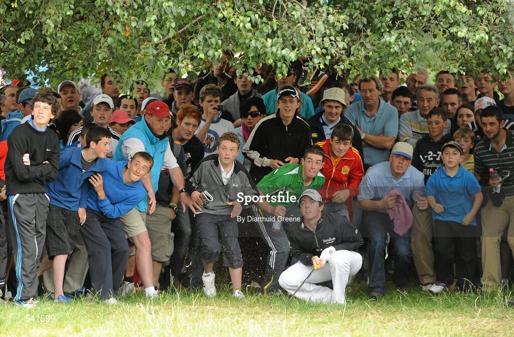 30 July 2011; Rory McIlroy watches his shot from the rough under a tree on the 9th hole during the third round of the 2011 Discover Ireland Irish Open Golf Championship, Killarney Golf & Fishing Club, Killarney, Co. Kerry. Picture credit: Diarmuid Greene / SPORTSFILE
