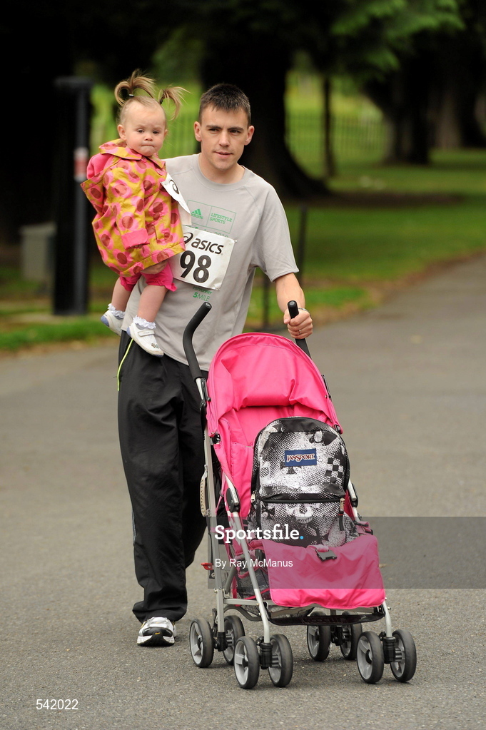 31 July 2011; Alan Murphy and 15 month old Zara, from Ballyfermot, Dublin, before the start of the Athletics Ireland Family Fitness Festival at Farmleigh. Phoenix Park, Dublin. Picture credit: Ray McManus / SPORTSFILE