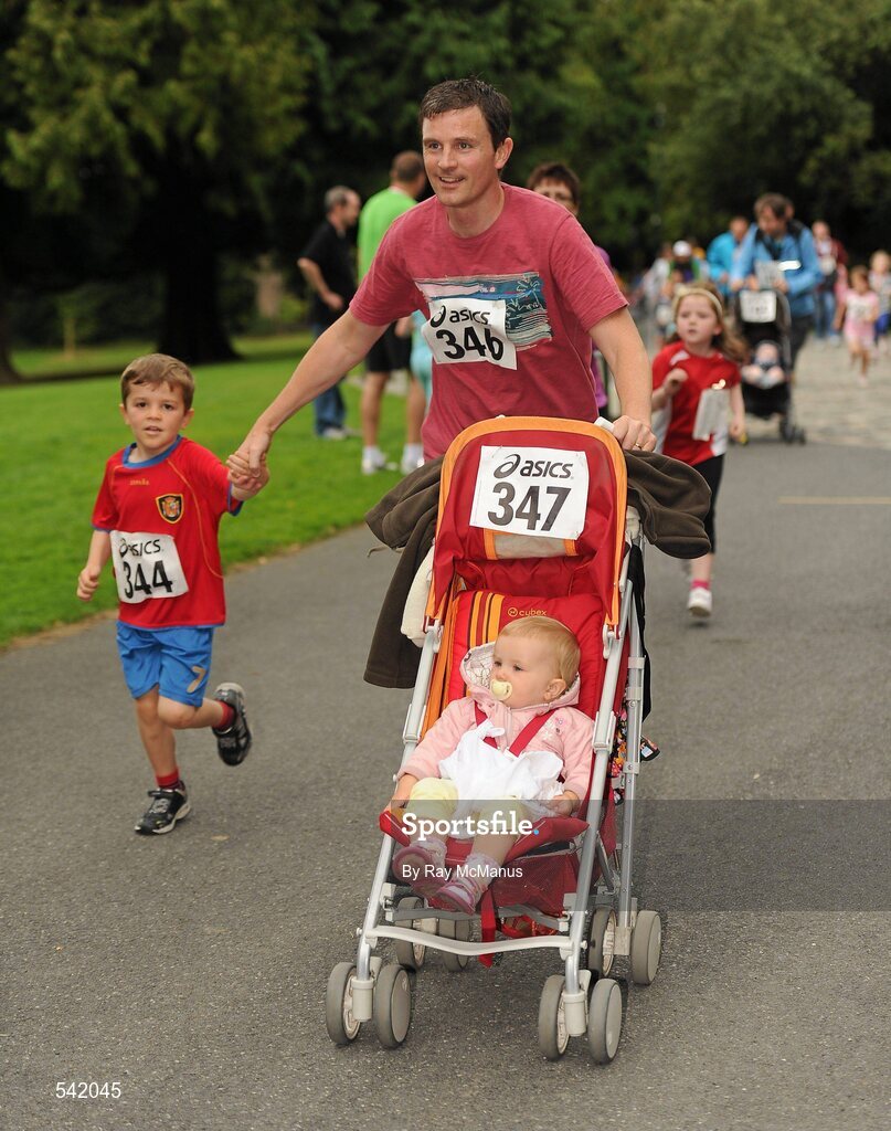 31 July 2011; Paul Byrne, from Saggart, Co. Dublin, runs to the finish with 15 month Eve and five year old Cillian, during Athletics Ireland Family Fitness Festival at Farmleigh. Phoenix Park, Dublin. Picture credit: Ray McManus / SPORTSFILE