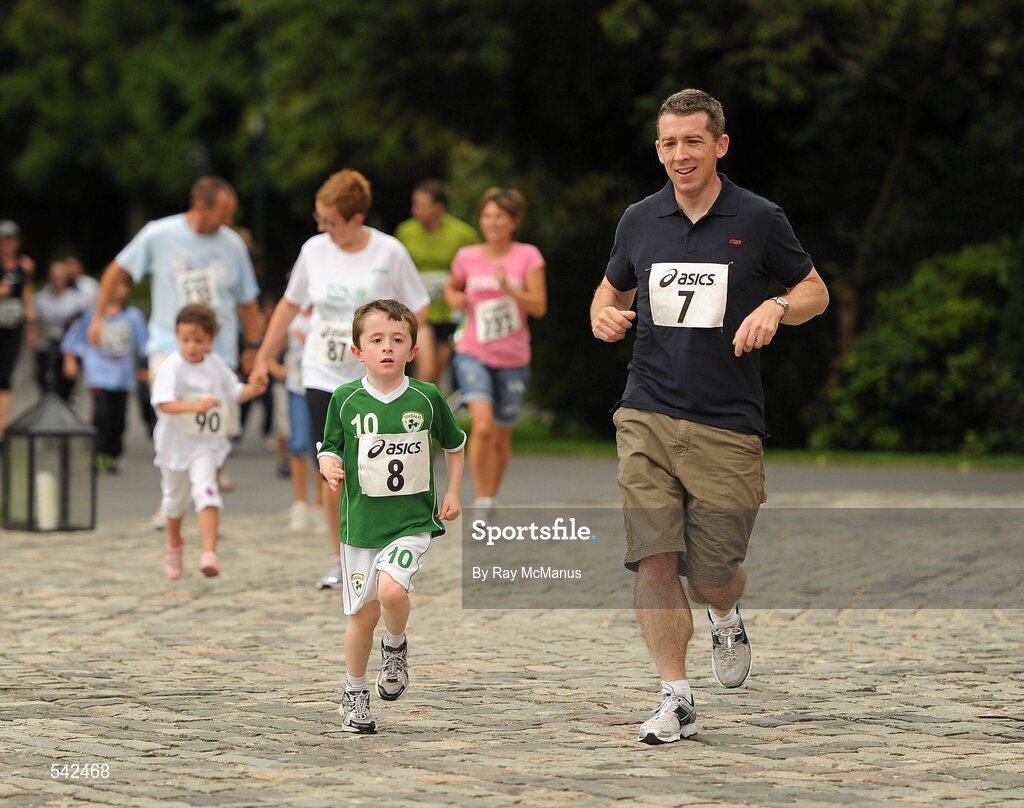 31 July 2011; Five year old James Nealon junoir, from Leislip, Co Kildare,  and his dad James run to the finish of the Athletics Ireland Family Fitness Festival at Farmleigh. Phoenix Park, Dublin. Picture credit: Ray McManus / SPORTSFILE